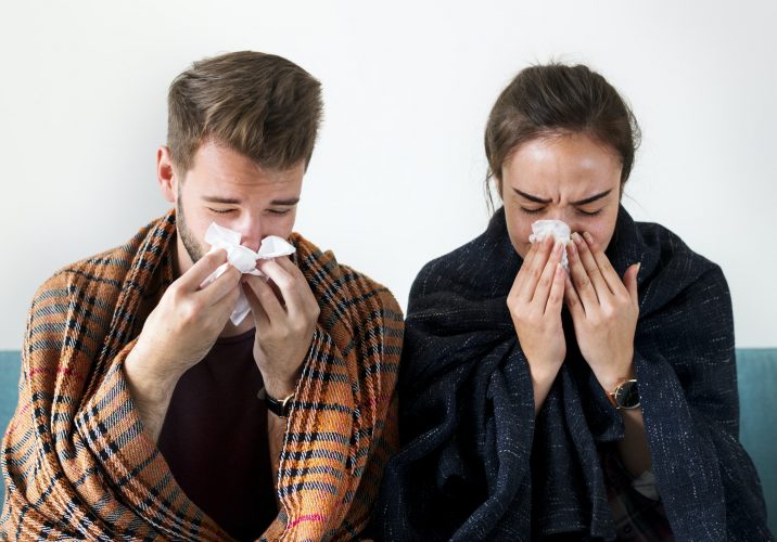 Sick couple with runny nose