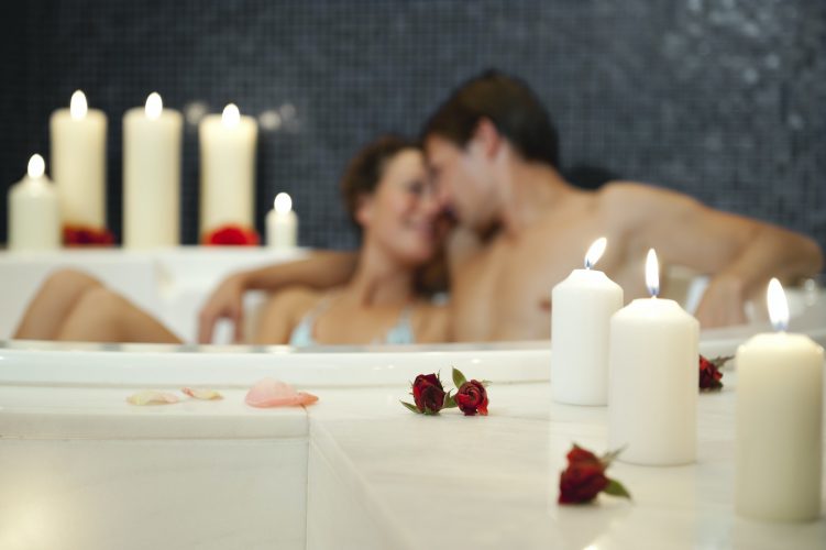 Italy, SouthTyrol, Couple having romantic bath in hotel urthaler