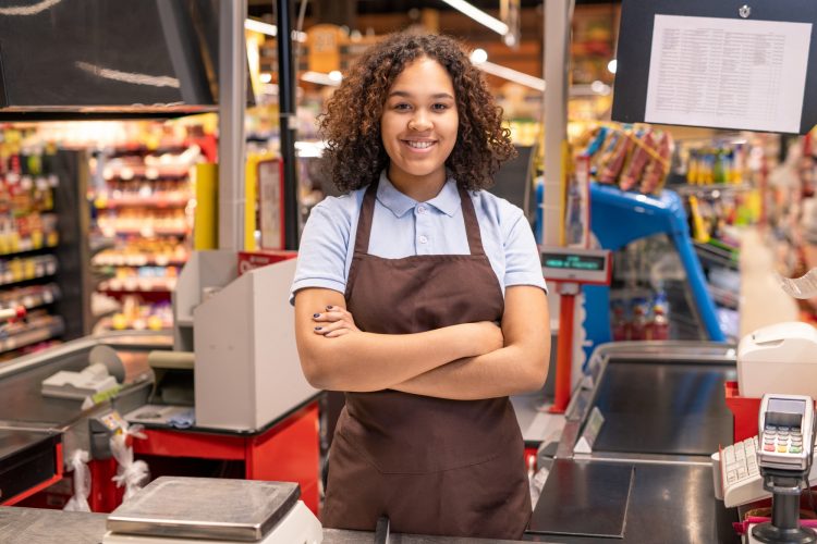 Young successful mixed-race sales clerk in workwear crossing her arms by chest