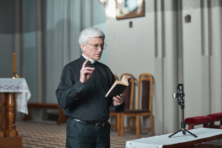 Priest reading mass online