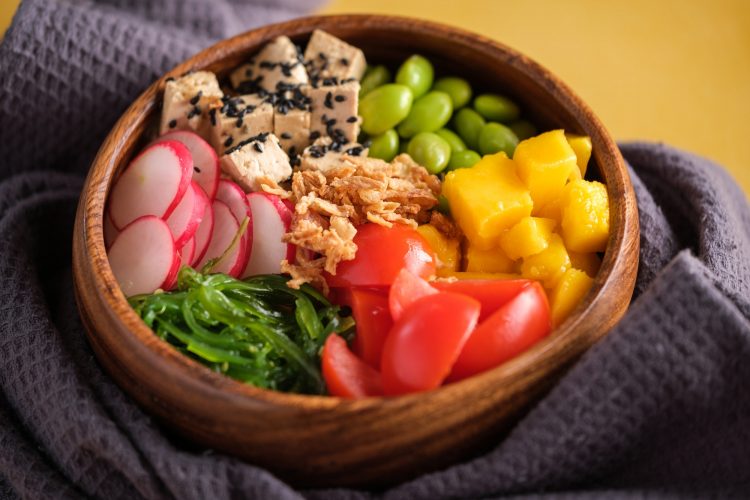 Healthy lunch vegan bowl on towel