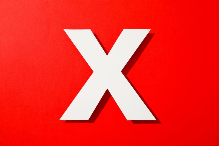 White letter X on color background, space for text