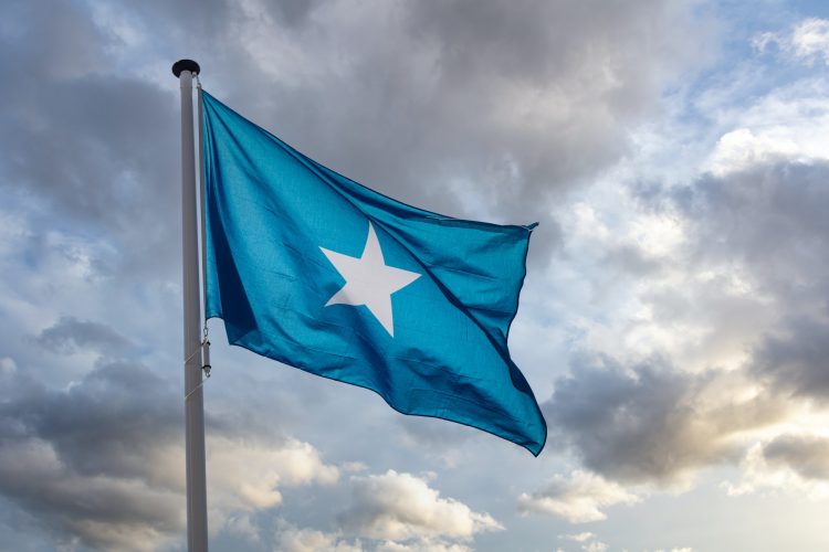Somalia flag waving against cloudy sky