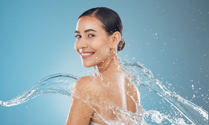 Beauty woman with water splash and skincare, clean and fresh skin, with body wellness, hydration an